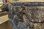 The cathedral of Cefal - Baptismal font (sec. XII) of dark marble and decorated with lions in bas-reliefs.