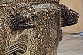 The cathedral of Cefal - Baptismal font (sec. XII) of dark marble and decorated with lions in bas-reliefs.