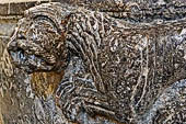 The cathedral of Cefal - Baptismal font (sec. XII) of dark marble and decorated with lions in bas-reliefs.