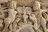 The cathedral of Cefal - The cloister. Capitals of the west side: Capital with naked figures. 