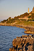 Cefal - the jagged cliffs of Calcaterra down to  the lighthouse.