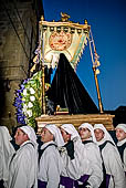 I riti della settimana santa, confrati della Maria SS Addolorata recano il fercolo della Madonna Addolorata. 