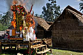 Cremation ceremony - The fuel ignites under the pyre and the splendid tower - coffin, offerings, decorations - is engulfed in flames.