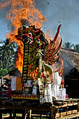 Cremation ceremony - The fuel ignites under the pyre and the splendid tower - coffin, offerings, decorations - is engulfed in flames.