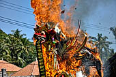 Cremation ceremony - The fuel ignites under the pyre and the splendid tower - coffin, offerings, decorations - is engulfed in flames.