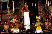 Sanghyang Dedari Dance - The two little dancers are brought out of trance by the pemangku, who prays beside them and blesses them with holy water. 