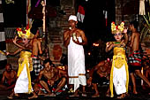 Sanghyang Dedari Dance - The two little dancers are brought out of trance by the pemangku, who prays beside them and blesses them with holy water. 