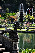 Tirtagangga, Bali - Detail of the bridge of the south pond with the fountain tower in the background.