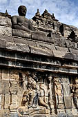 Borobudur - The outer wall of the first balustrade decorated with reliefs of celestial beings and guardian demons.