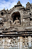 Borobudur - The outer wall of the first balustrade decorated with reliefs of celestial beings and guardian demons.