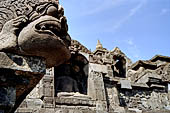 Borobudur - Water sprouts shaped like makaras are used on the lowest level, at the upper levels kala-like faces are used.