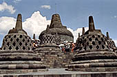 Borobudur - The 72 small stupa containing the Buddha statues on the upper three circular terraces around the central stupa.