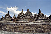 Borobudur - The 72 small stupa containing the Buddha statues on the upper three circular terraces around the central stupa.