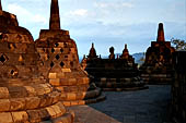 Borobudur - The 72 small stupa containing the Buddha statues on the upper three circular terraces around the central stupa.