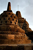 Borobudur - The 72 small stupa containing the Buddha statues on the upper three circular terraces around the central stupa.