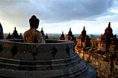 Borobudur - The 'invisible' Buddha placed inside  the bell shaped stupa of the upper terraces, two of them have been left exposed.