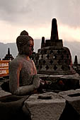 Borobudur - The 'invisible' Buddha placed inside  the bell shaped stupa of the upper terraces, two of them have been left exposed.