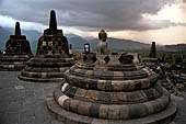 Borobudur - The 72 small stupa containing the Buddha statues on the upper three circular terraces around the central stupa.