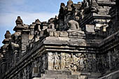 Borobudur - The outer wall of the first balustrade decorated with reliefs of celestial beings and guardian demons.