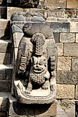 Borobudur - Makara head with a lion in its mouth flanking one of the stairways leading up to the monument.