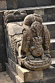 Borobudur - Makara head with a lion in its mouth flanking one of the stairways leading up to the monument. 