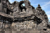 Borobudur - The outer wall of the first balustrade decorated with reliefs of celestial beings and guardian demons. 