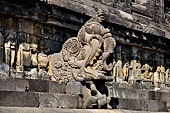 Borobudur - Water sprouts shaped like makaras are used on the lowest level, at the upper levels kala-like faces are used.