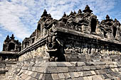 Borobudur - The outer wall of the first balustrade decorated with reliefs of celestial beings and guardian demons.