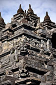 Borobudur - Water sprouts shaped like makaras are used on the lowest level, at the upper levels kala-like faces are used.