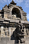 Borobudur - Water sprouts shaped like makaras are used on the lowest level, at the upper levels kala-like faces are used.