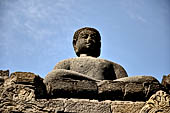 Borobudur - Buddha statues on the balustrades of the lower levels.