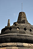 Borobudur - The 'invisible' Buddha placed inside  the bell shaped stupa of the upper terraces, two of them have been left exposed.