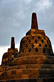 Borobudur - The 72 small stupa containing the Buddha statues on the upper three circular terraces around the central stupa. 