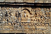 Borobudur reliefs - First Gallery, Northern side - Panel 94. The battle of Mara, Sakyamuni is shown in the gesture  to call the earth to witness.