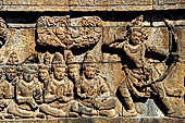 Borobudur reliefs - First Gallery, North-Eastern side - Panel 119. Unidentified scene od the avadana where a nobleman lets fly an arrow. 