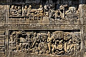 Borobudur reliefs - First Gallery, Northern side - Lalitavistara. Panel 89. Sakiamuni throws golden bowl in the river. 