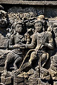 Borobudur reliefs - First Gallery, Northern side - Panel 89. A pair of kinnaras, celestial beings half bierd half human. 