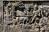 Borobudur reliefs - First Gallery, Northern side - Panel 89. A pair of kinnaras, celestial beings half bierd half human. 