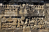 Borobudur reliefs - First Gallery, Northern side - Lalitavistara. Panel 97. Gods send umbrellas for shelter. 