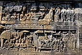 Borobudur reliefs - First Gallery, Northern side - Lalitavistara. Panel 100. Sakiamuni returning to the Bodhimanda. 