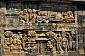 Borobudur reliefs - First Gallery, North-Eastern side - Lalitavistara. Panel 112. Feast on the journey to Sarnath 