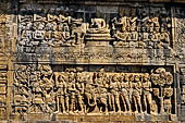 Borobudur reliefs - First Gallery, North-Eastern side - Lalitavistara. Panel 114. On the journey to Sarnath 