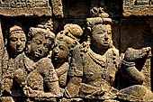 Borobudur reliefs - First Gallery, South-Eastern side - Panel 10. Lalitavistara. Gods discuss who should accompany Buddha on his descent Detail. 