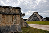 Chichen Itza - The Platform of the Eagles and Jaguars, in the background the big pyramid of Kukulcan