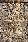 Chichen Itza - Great Ball court. Detail of the bas-reliefs on the side benches.