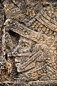 Chichen Itza - Great Ball court. Detail of the bas-reliefs on the side benches.