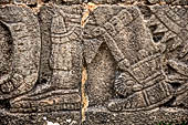 Chichen Itza - Great Ball court. Detail of the bas-reliefs on the side benches.