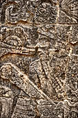 Chichen Itza - Great Ball court. Detail of the bas-reliefs on the side benches.