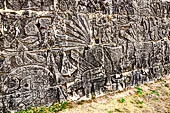 Chichen Itza - Great Ball court. Detail of the bas-reliefs on the side benches.