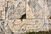 Chichen Itza - Great Ball court. Detail of the bas-reliefs on the side benches. A skull inside the ball marks the canter of the panel.